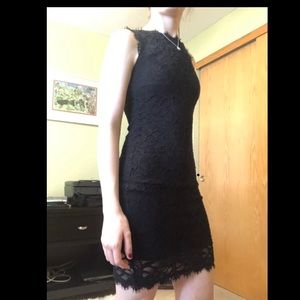 Form fitting, black, lace dress.
